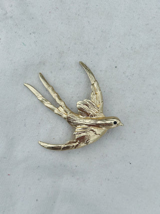 Broche pájaro ojo negro
