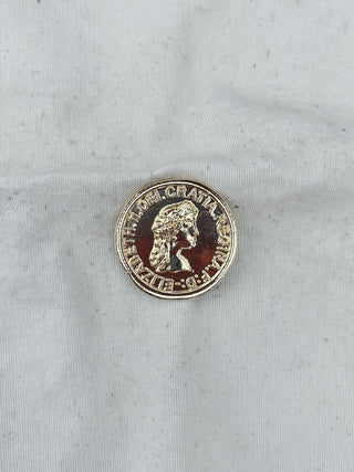 Broche moneda